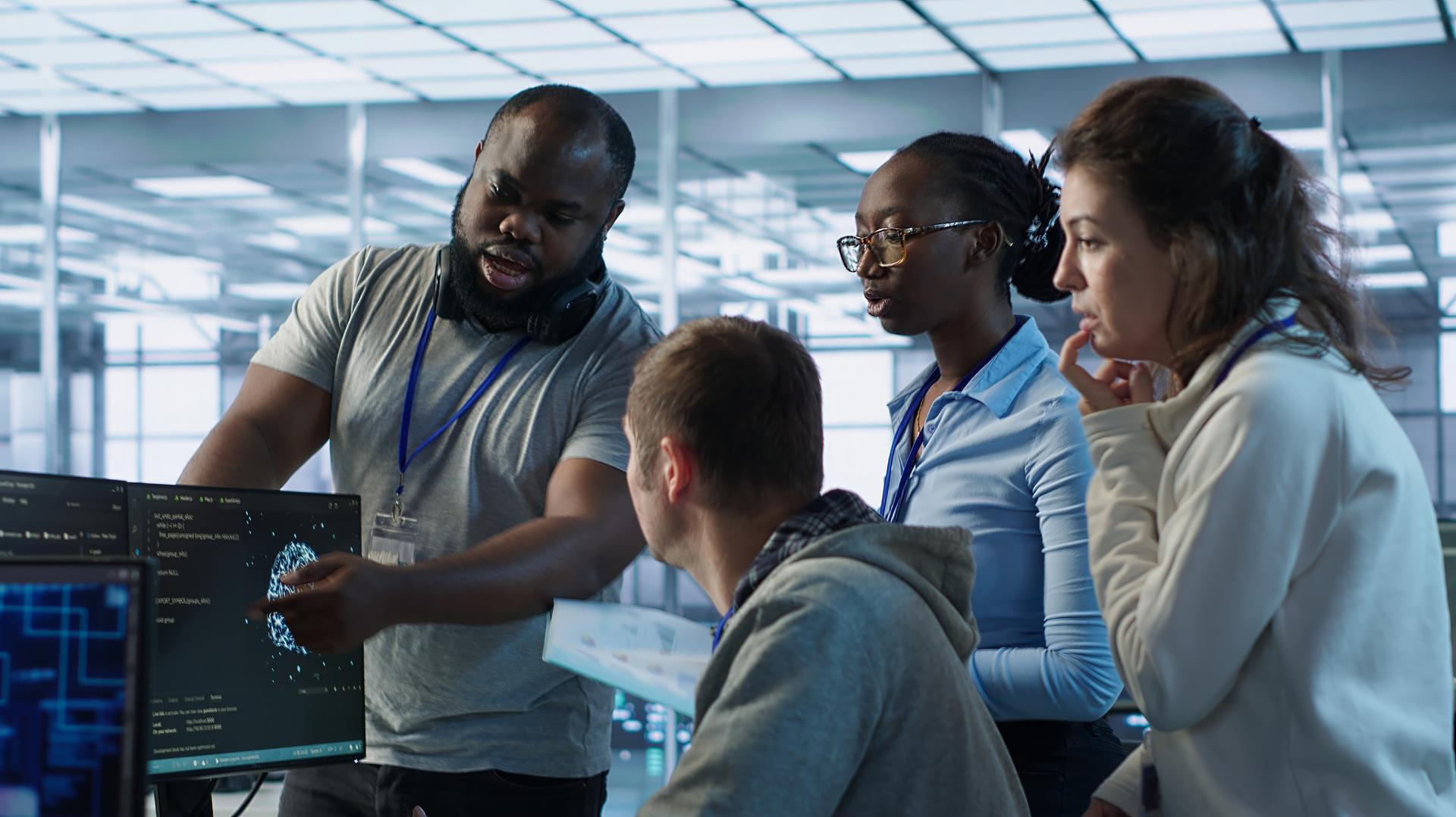 AI engineers reviewing a production model together